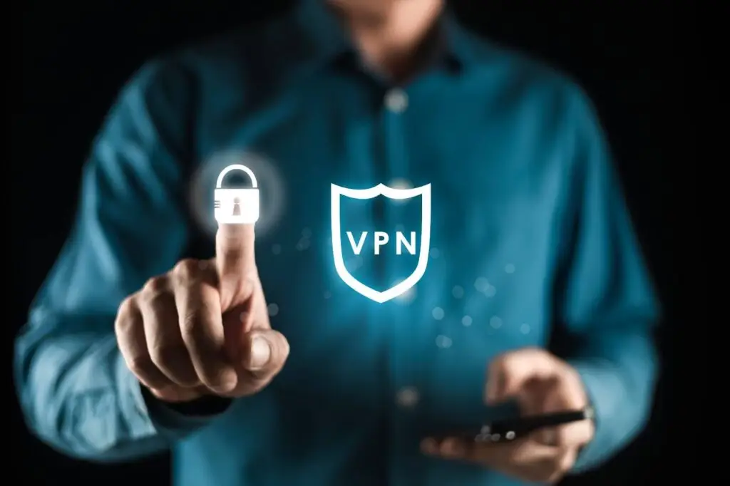 A man holding his smartphone and turning VPN protection on