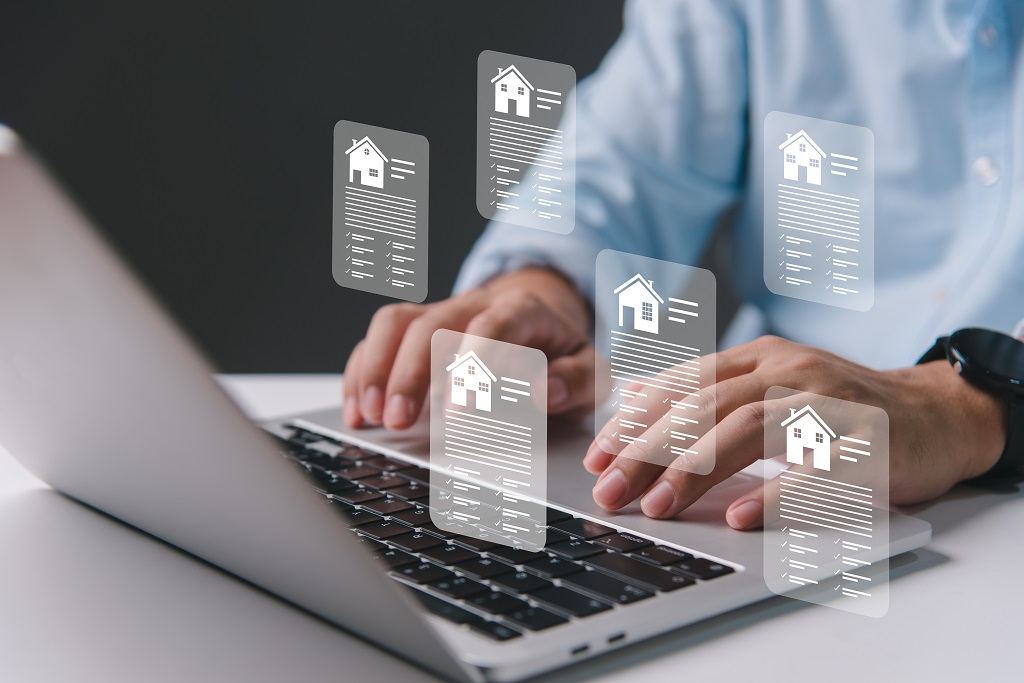 A person browsing real estate offers on their laptop