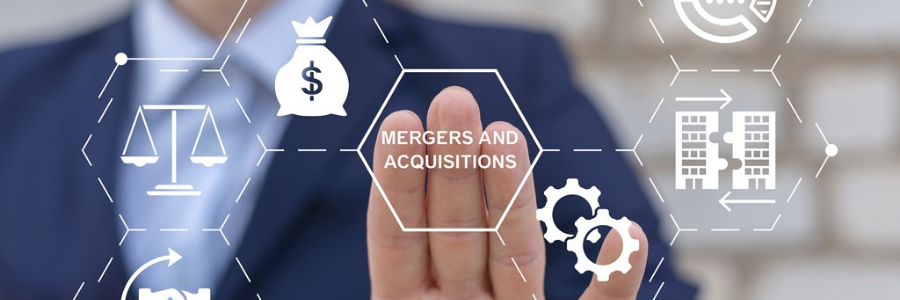 A person using a virtual touch screen presses the words MERGERS AND ACQUISITIONS.